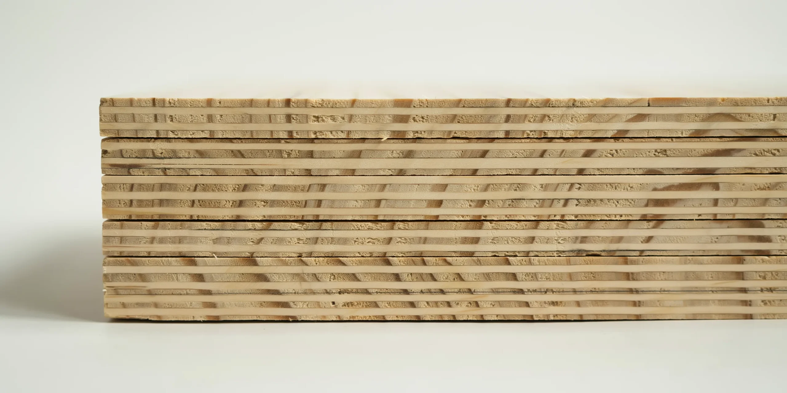 Close-up of Cross-Laminated Timber panel highlighting its layered structure and texture
